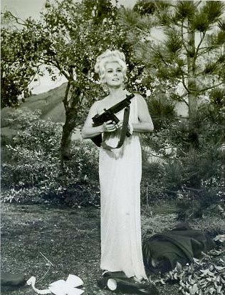 Lisa with a machine gun...from her WWII days