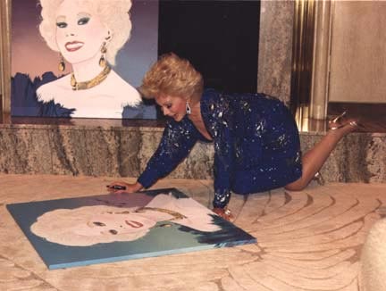 Eva Gabor Signs a Fan's Artwork
