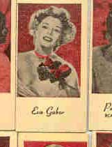 A touch smaller than a tobacco card, these came out of weighing machines after you paid a penny and weighed yourself. The backs tell a little story about you (You are quick to excuse a fault......), and say Engrave-o-tints, Portraits of Movie Stars, and Peerless Wghg. & Vendg. Mch. Corp., Litho USA.